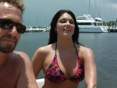Hot ass milf reveals her tits on the boat