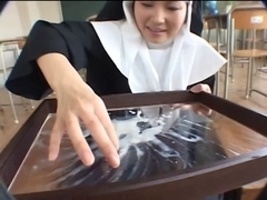 Nun receives a tribute and eats it
