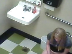 Blonde girl in pees in a public toilet
