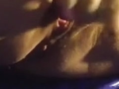 Aged wife masturbating with a small purple toy and squirting