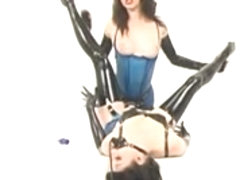 Brunette with strap on acts as latex lesbo mistress 