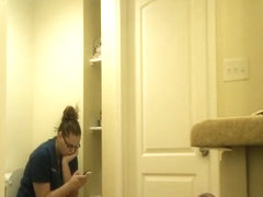 Chubby nerd girl in toilet