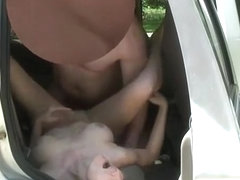 Couple fucking in the backseat of their car