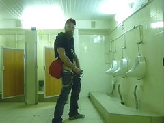 Guy stroke in public toilet