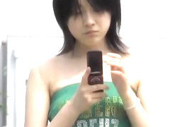 Black-haired pretty bimbo is texting her boyfriend in the middle of sharking