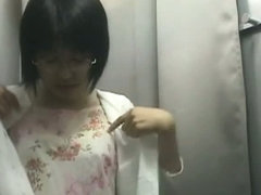 Hidden camera in changing room shows a hot bodied Asian girl.