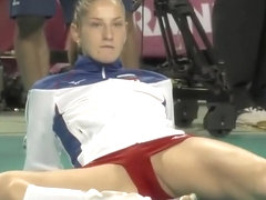 Pro sport babe stretches on the floor