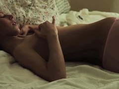 Aroused teen Anjelica pleasures herself in bedroom