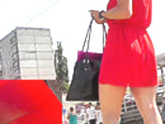 Brunette coquette's hot red dress presents upskirt view