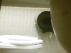 Public toilet voyeur surprise !!! did she buttplug her ass ???