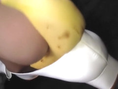 Aggressively driving banana under my stocking feet