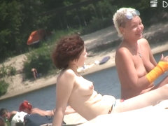 Boobs and asses of mature nudist women shots by beach voyeur