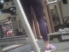 Woman in dark sports pants exercising