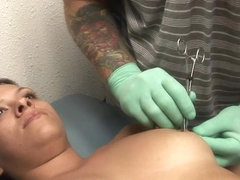 hot brunette college girl getting her nipples pierced