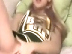 Blonde Cheerleader On A Bed