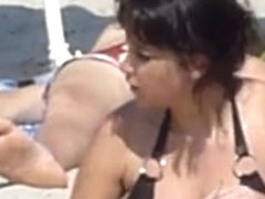 Beach voyeur 02 - A topless gril and her large boobs ally