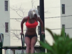 Setaming hot blonde Dee is working out outdoor