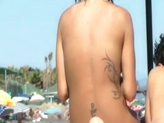 Tattooed nudist woman spied beach